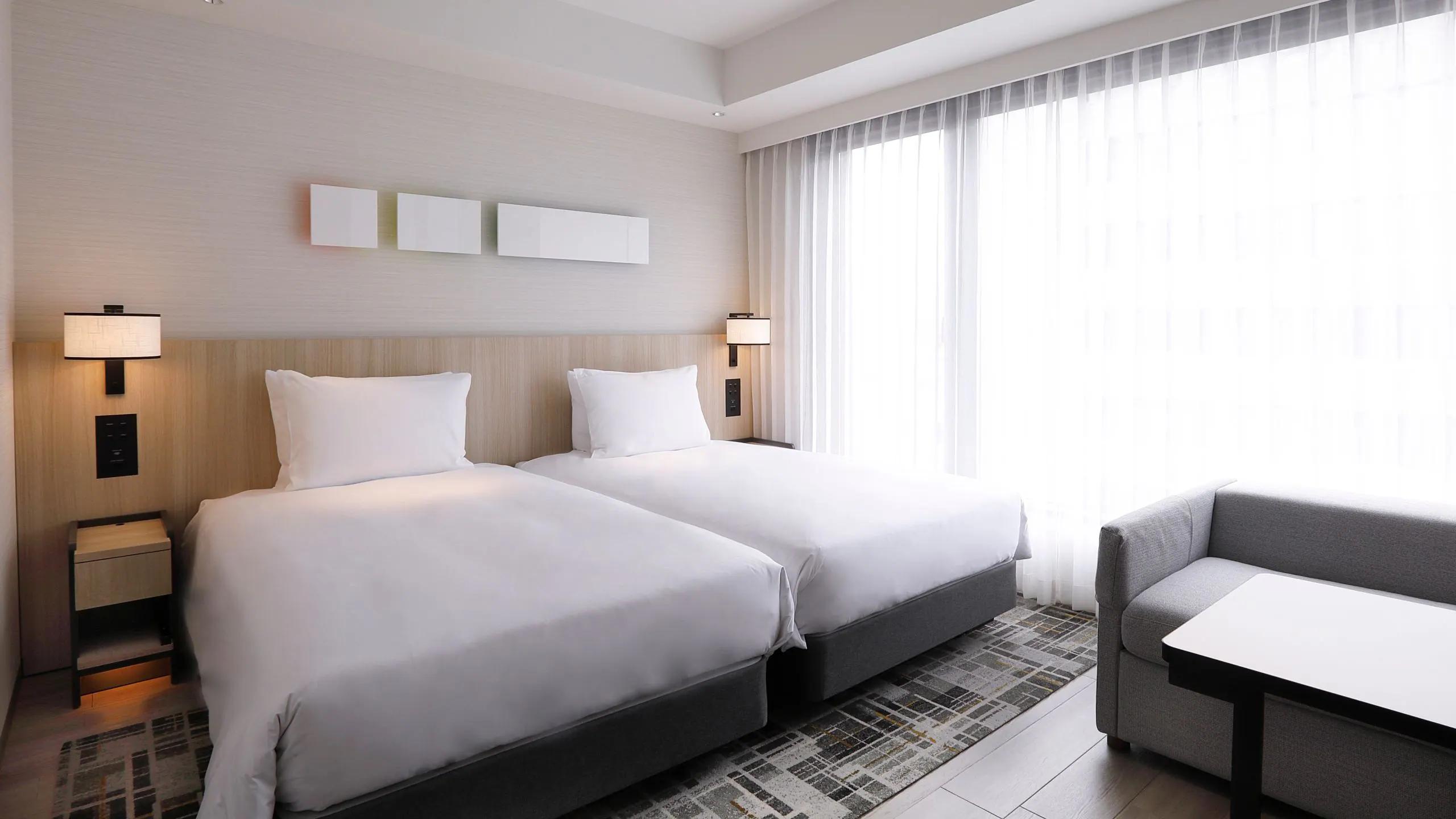 KYOZK-P0067-Main-Twin-Guestroom-Day.16x9.webp